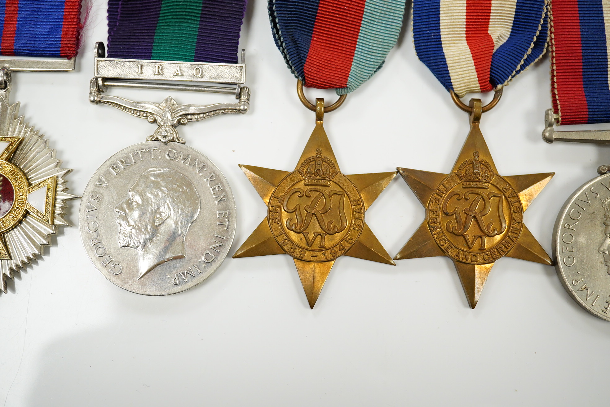 Seven military medals, including; a WWII medal group including the 1939-1945 Star, the France and Germany Star and the 1939-1945 Medal, a George V General Service Medal with a bar for Iraq awarded to GNR. G. Fuller R.A.